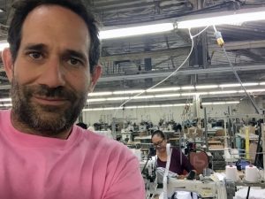 Dov Charney in textile warehouse