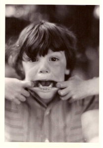 A young boy making a face
